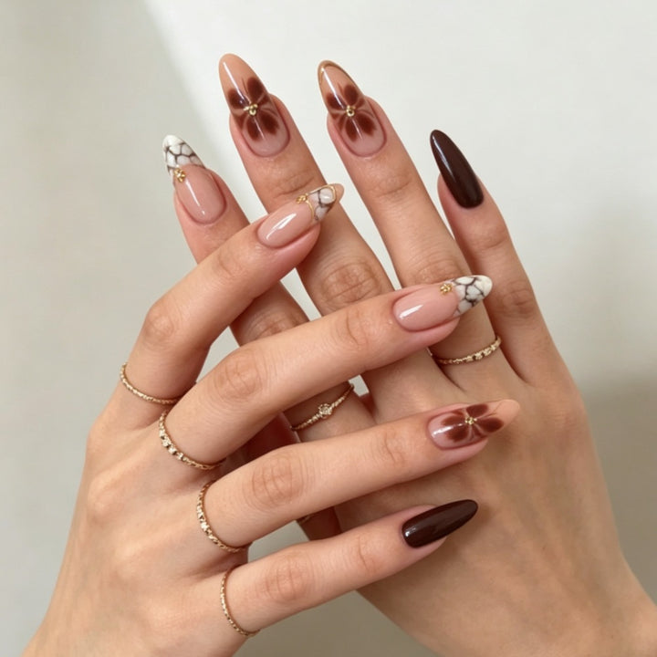 Artificial nails with elegant marble pattern and delicate accents Stornfield