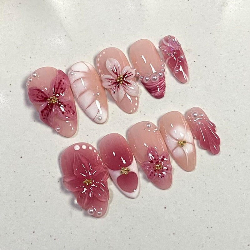 Artificial nail set with floral design and glitter accents Stornfield