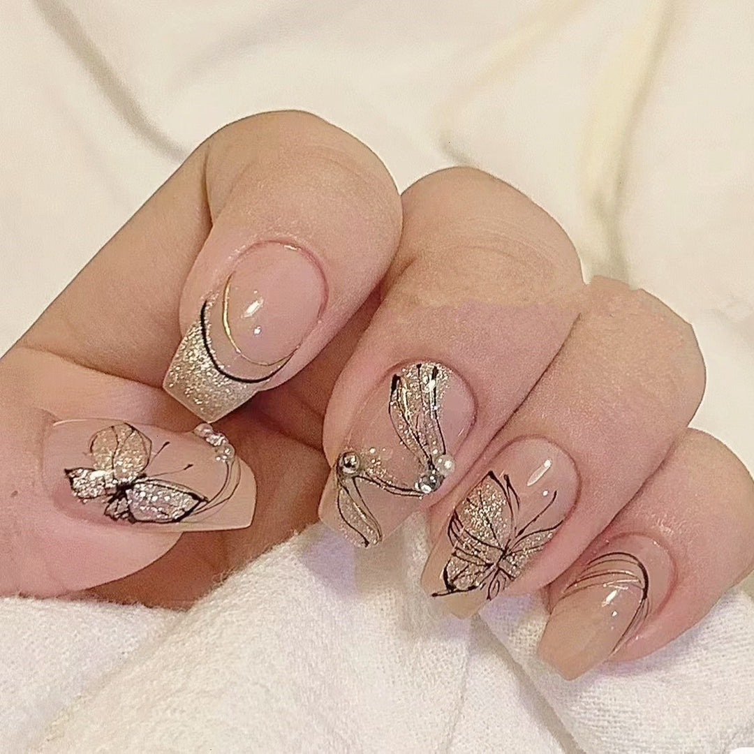Artificial nails with filigree butterfly design Stornfield