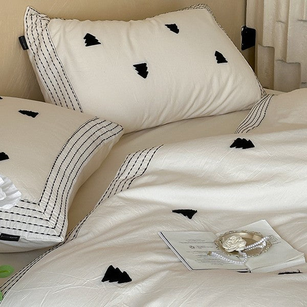 Linen-cotton blend duvet cover set with embroidered accent motifs and striped border
