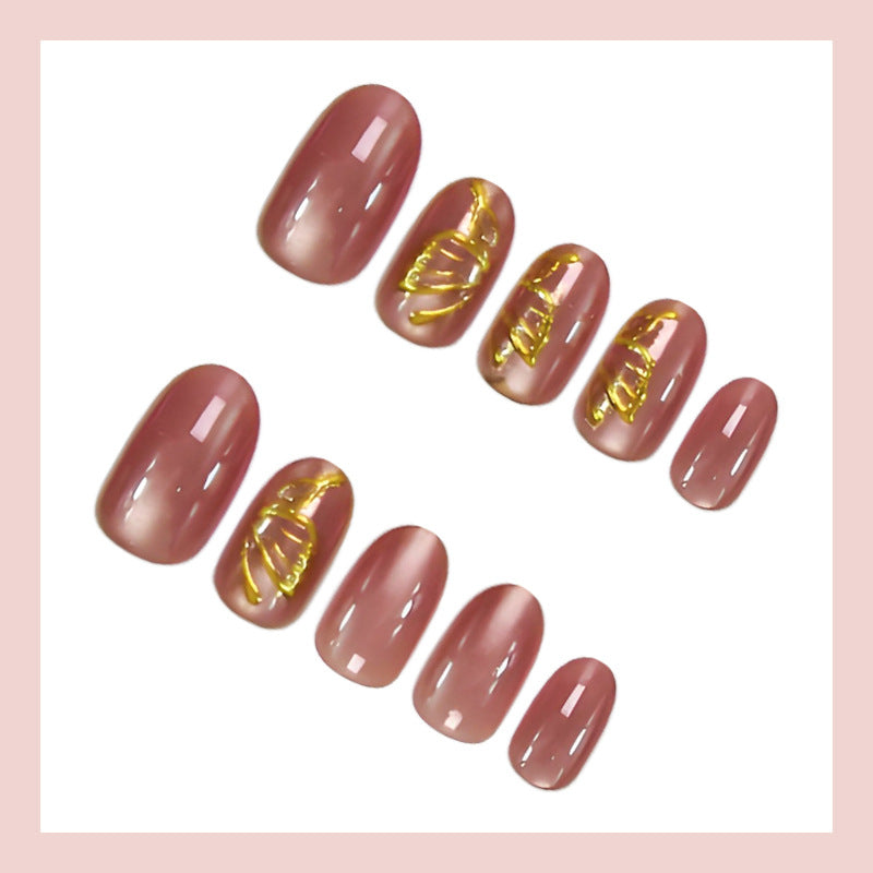Acrylic nail set with elegant golden accents and shimmering finish Stornfield