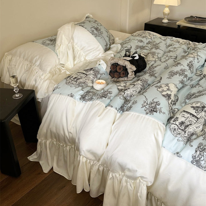 Romantic satin bedding set with ruffles, frills, and classic toile motif