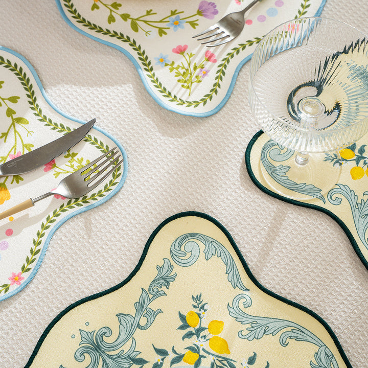 Shaped placemat made of cotton blend with pomegranate and parrot motif