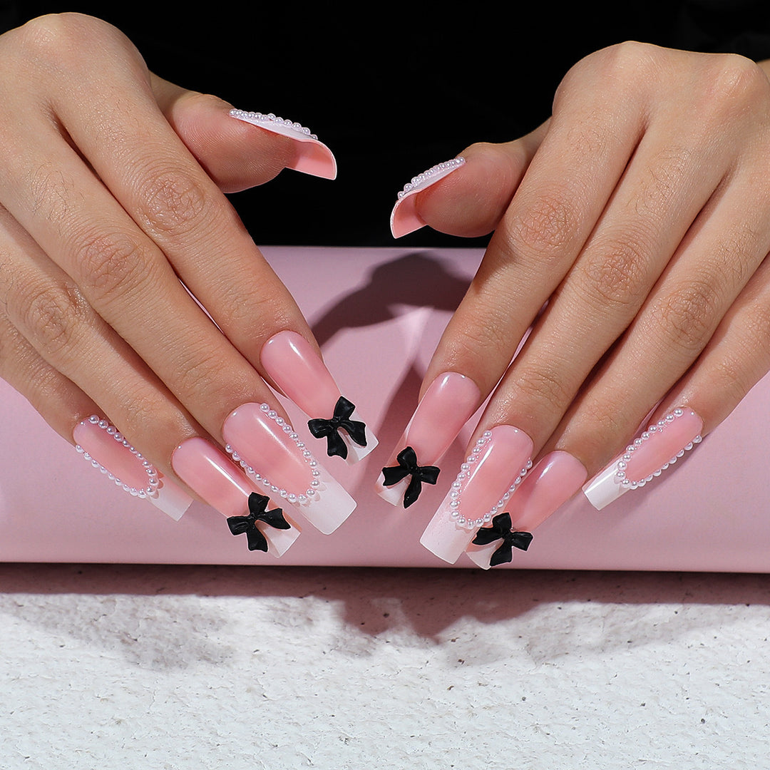Artificial nail set with elegant rhinestone and bow decorations Stornfield