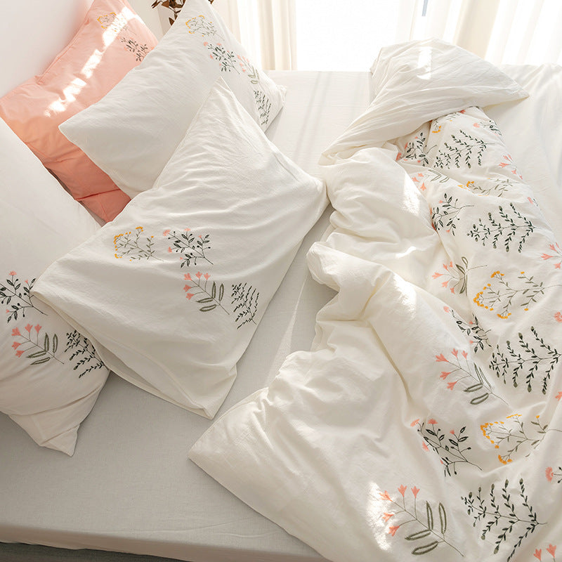 Embroidered cotton muslin bedding set with delicate flower appliqués and extra soft fitted sheet