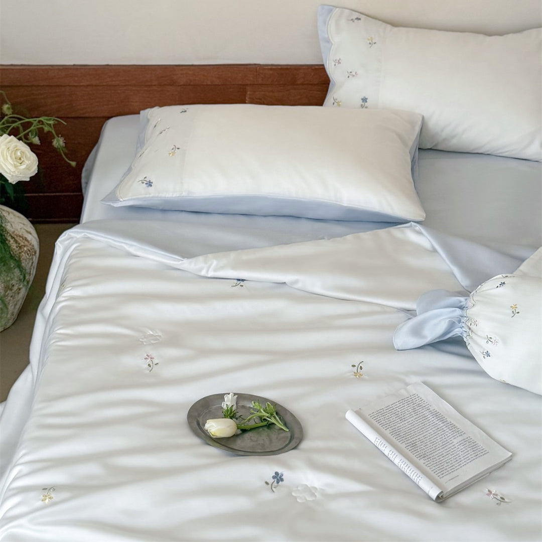 Embroidered satin bedding set with fine floral embroidery and silky-soft touch