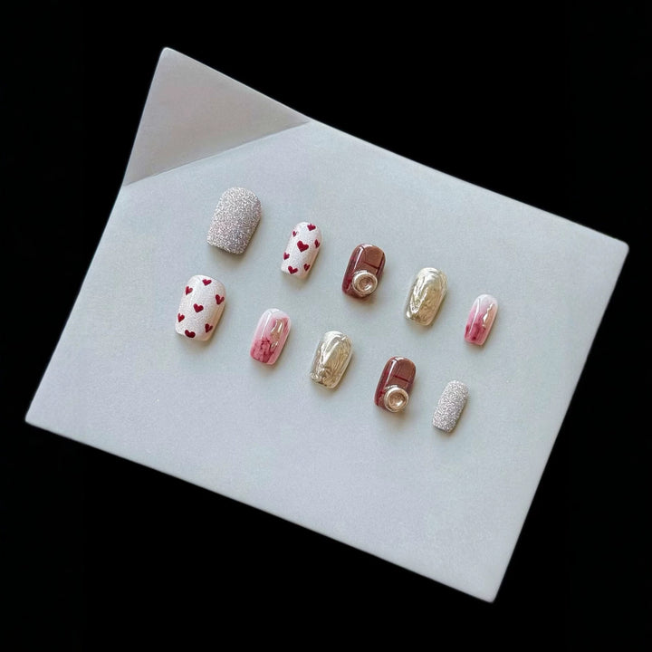 Artistic Press-On Nail Set with Heart and Glitter Accents