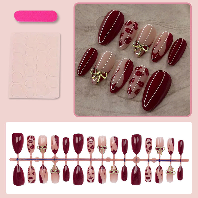 Artificial nail set with elegant bow and kiss mouth designs Stornfield
