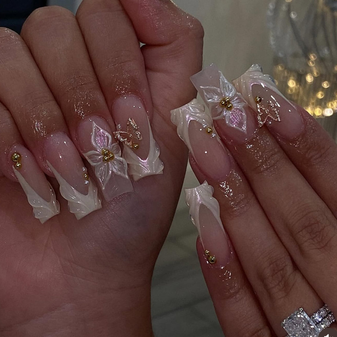 Elegant artificial nails with floral design and gold accents Stornfield
