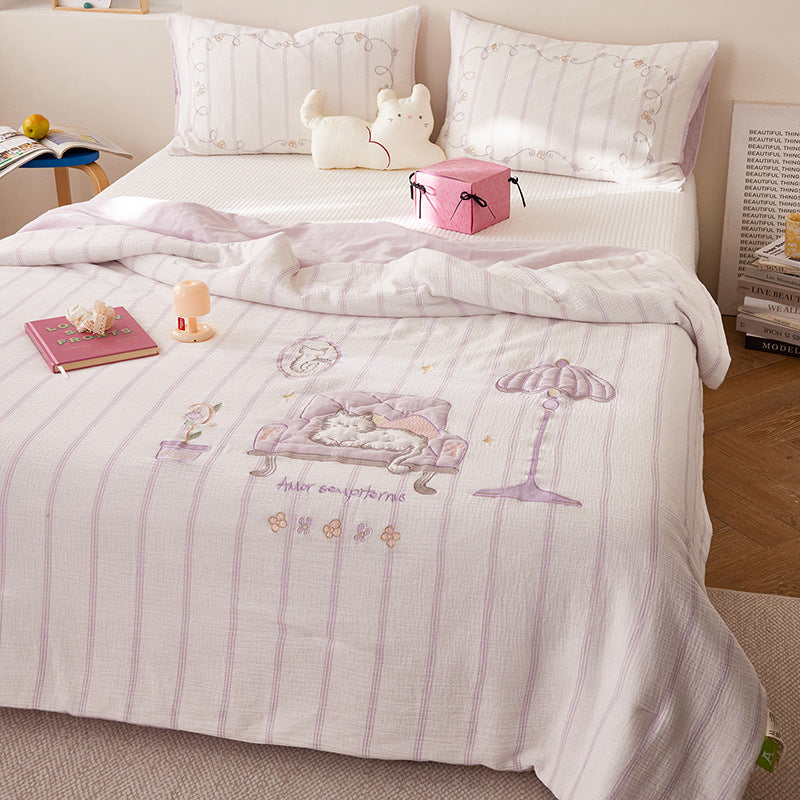 Quilted bedding and throw set with appliquéd plush puppy made of cotton muslin