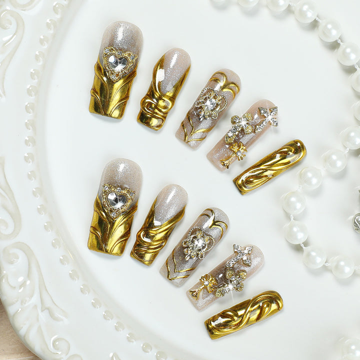Artificial nail set with luxurious gold embellishments Stornfield