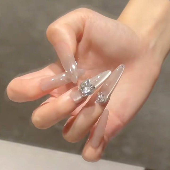 Acrylic nail set with glitter design and elegant 3D applications Stornfield