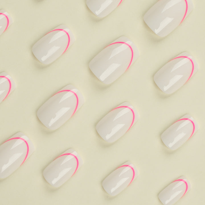 Stylish artificial nails with elegant French tip and modern accents Stornfield