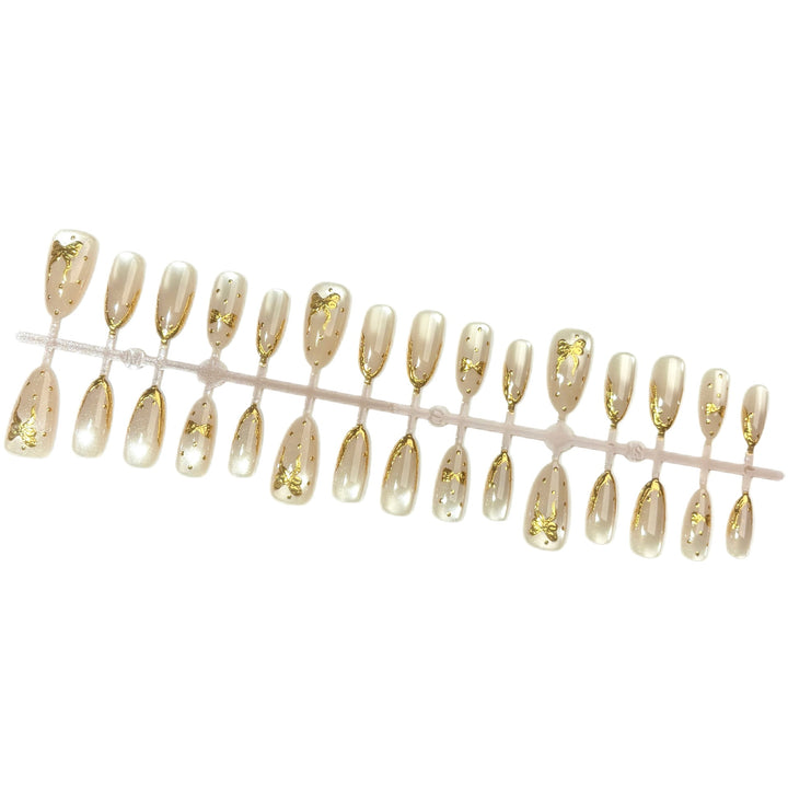 Elegant Press-On Nail Set with Gold Bow Accents