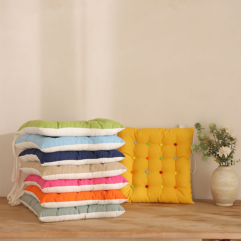Padded quilted seat cushion with colorful button applications and non-slip underside Stornfield