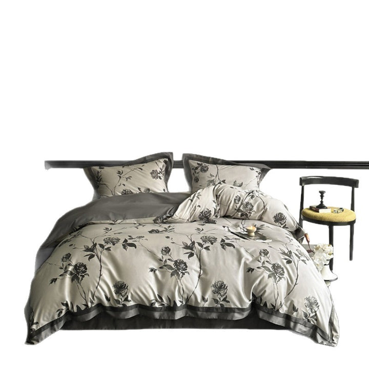 Reversible bedding set made of cotton satin with floral jacquard look and decorative hem