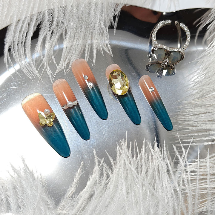 Glamorous artificial nails with elegant ombre effect and high-quality embellishments Stornfield