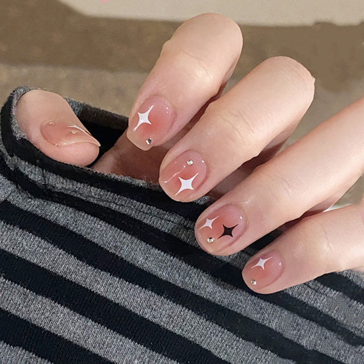 Acrylic nail set with sparkling star decorations and elegant accents Stornfield