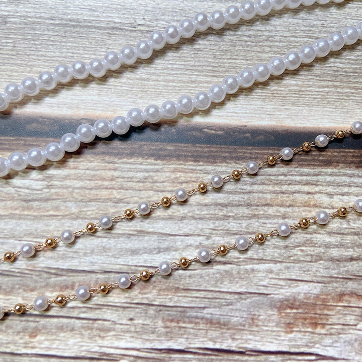Pearl jewelry chain with golden link chain Stornfield