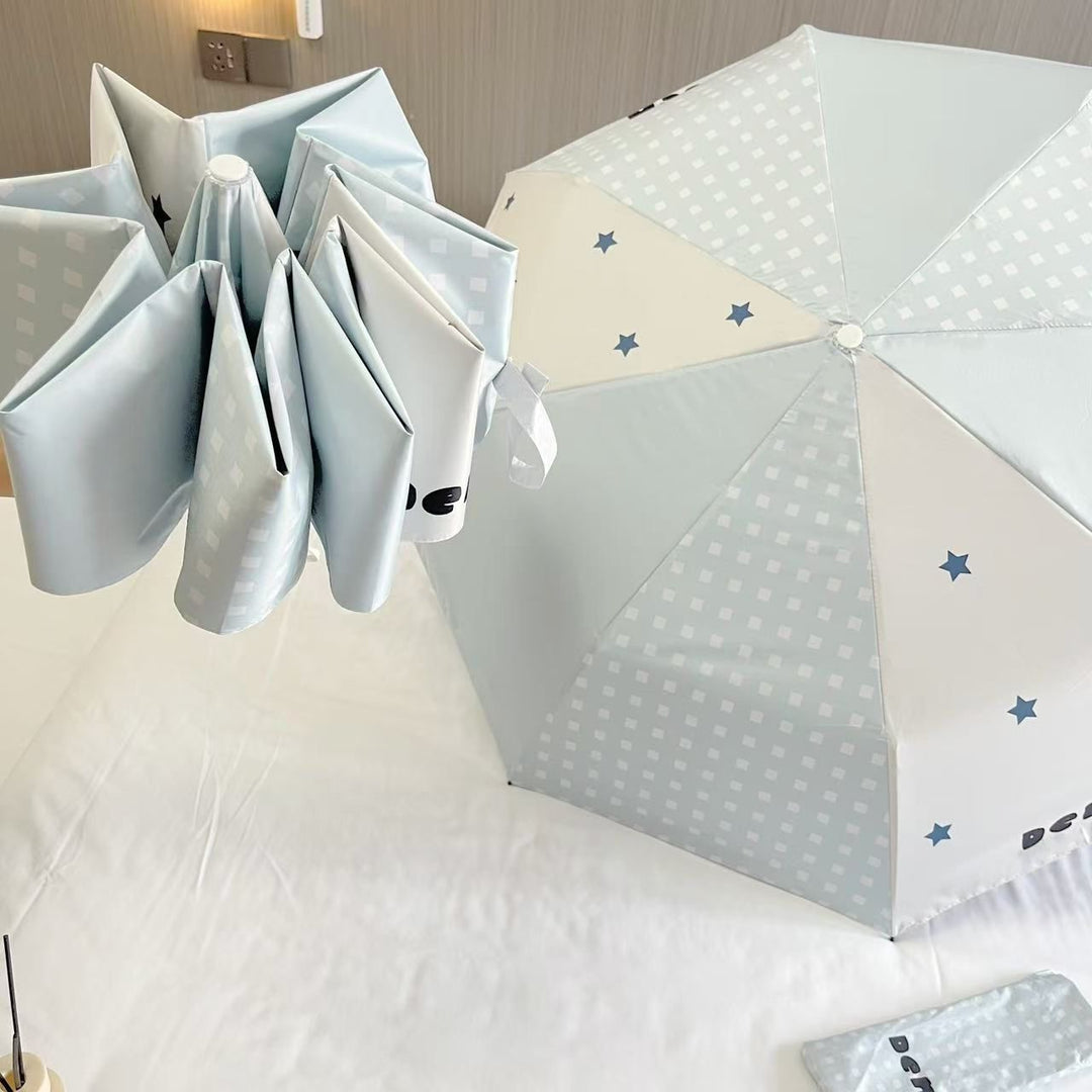Women's folding umbrella with unique star pattern and practical carrying bag Stornfield