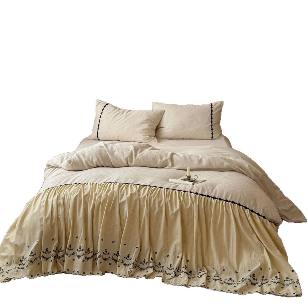 Bedding set with gathered bed skirt, embroidered trim and cotton-linen mix
