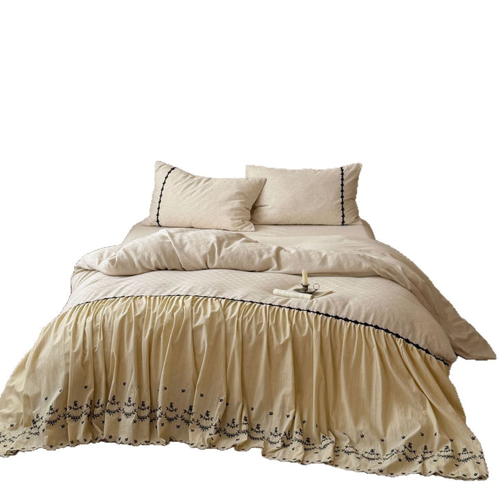 Bedding set with gathered bed skirt, embroidered trim and cotton-linen mix
