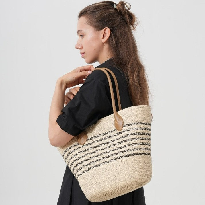 Beach bag made of natural woven material with elegant accents Stornfield