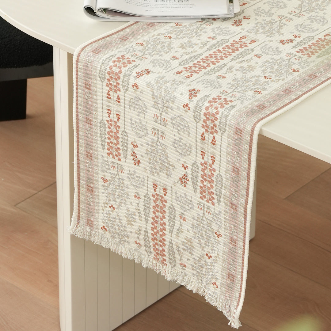 Woven jacquard table runner with floral medallion and fringes Stornfield
