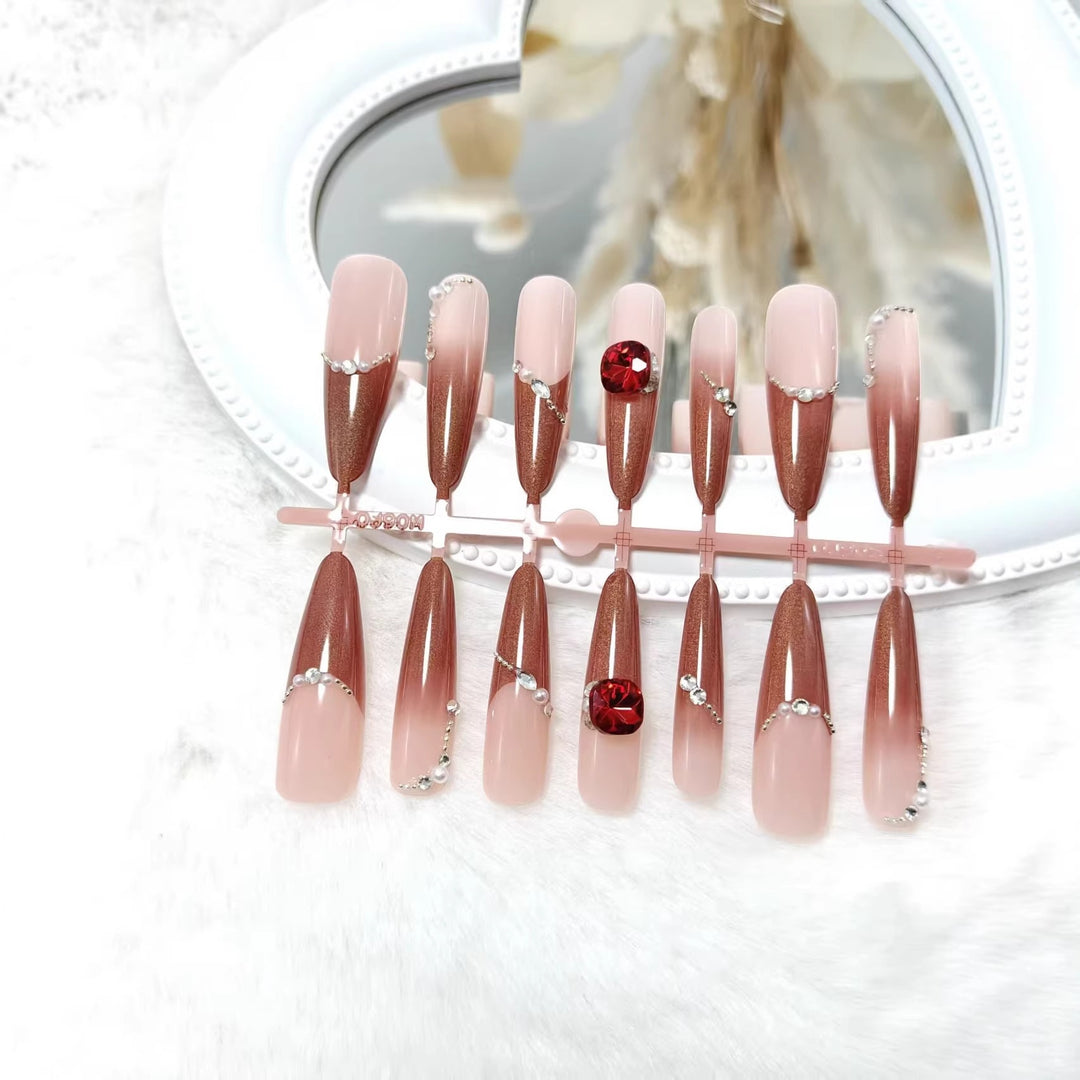 Artificial nails with luxurious 3D decorations and glamorous accents Stornfield