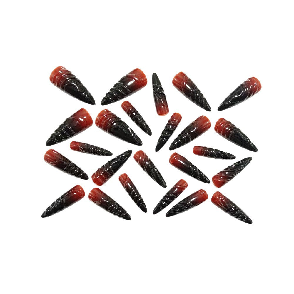 Gothic-style artificial nails with pointed tips and shiny surface Stornfield