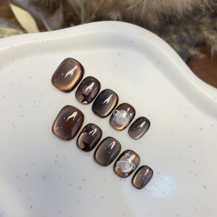 Artificial nail set with star and planet design Stornfield