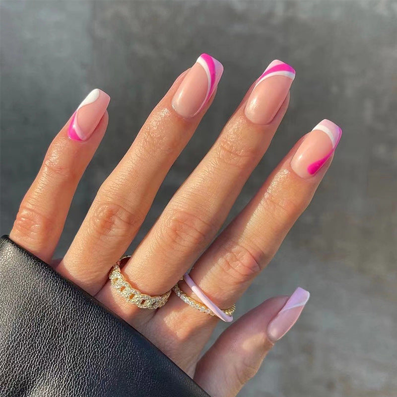 Acrylic nail extensions with elegant gradient and curved accents Stornfield
