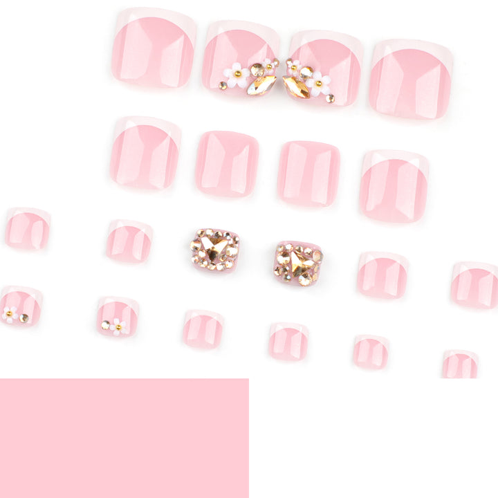 Artistic toenail art with elegant flower and glitter accents Stornfield