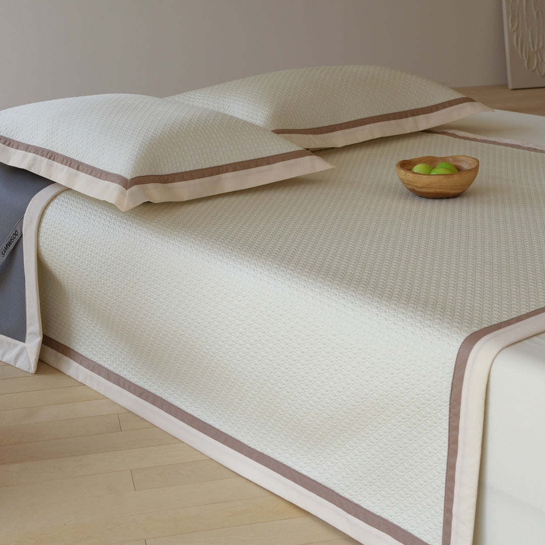 Quilted bedspread with textured waffle pattern and pillowcases