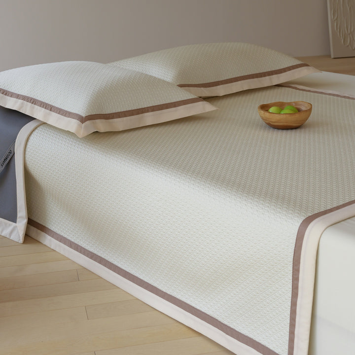 Quilted bedspread with textured waffle pattern and pillowcases