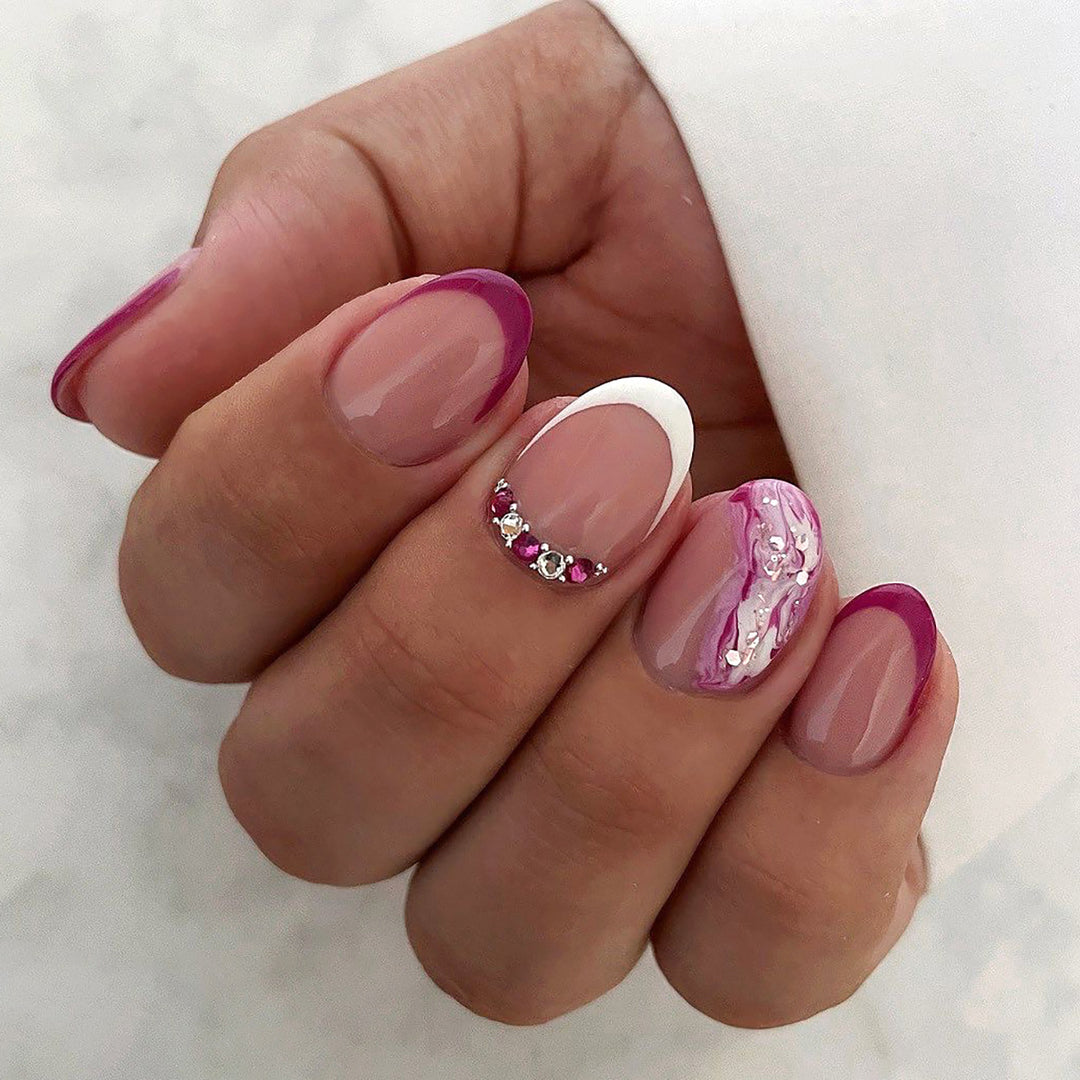 Elegant artificial nails with glamorous gradient colors and rhinestone accents Stornfield