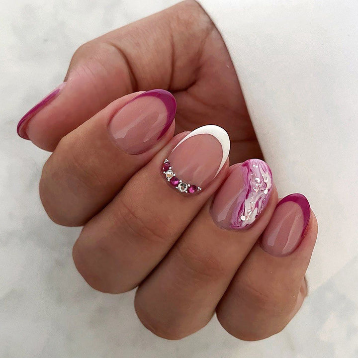 Elegant artificial nails with glamorous gradient colors and rhinestone accents Stornfield