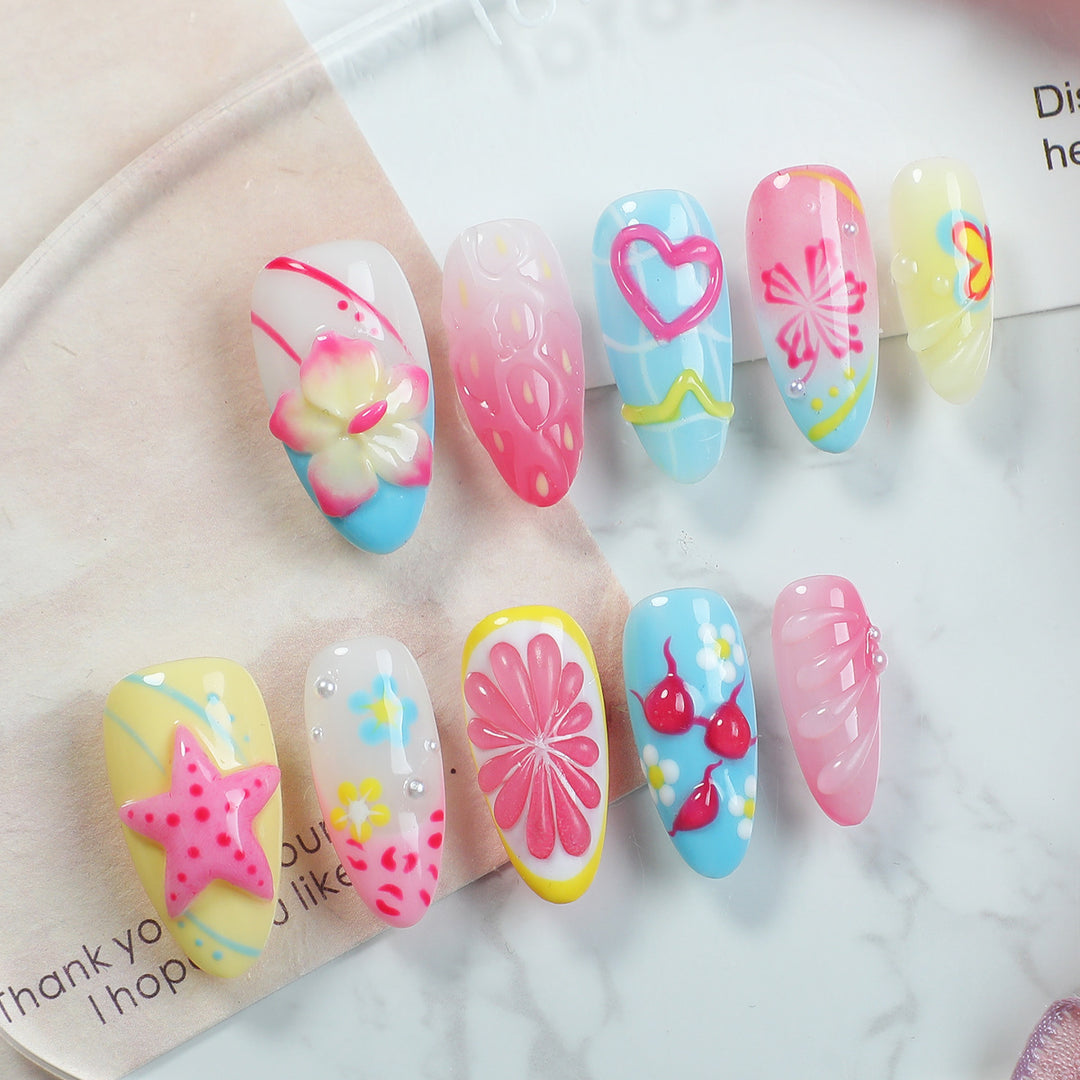 Creative nail art set with playful floral design and glitter effects Stornfield