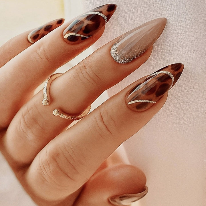 Nail art set with leopard pattern and glitter embellishments Stornfield