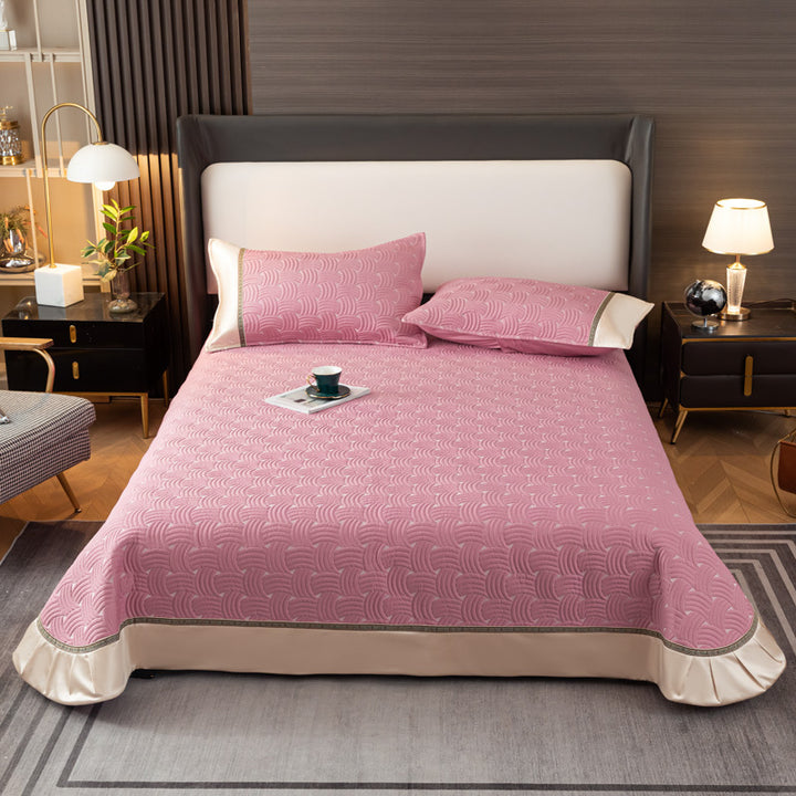 Quilted bedspread set with satin ruffle and geometric wave relief