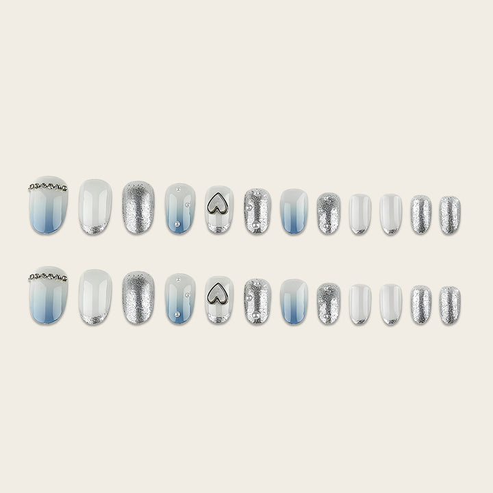 Glamorous artificial nails with heart design and pearl details Stornfield