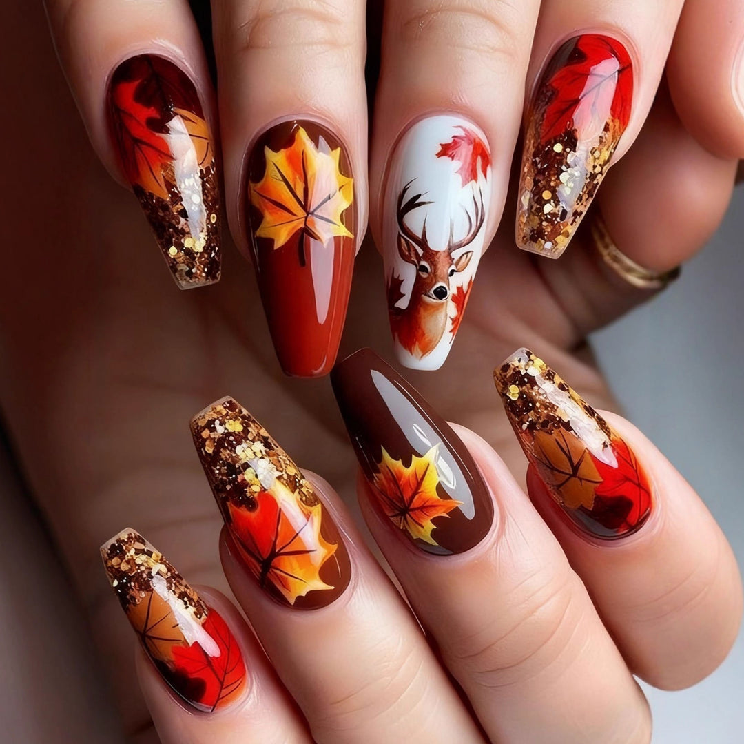 Artificial nail art with autumn leaf design Stornfield