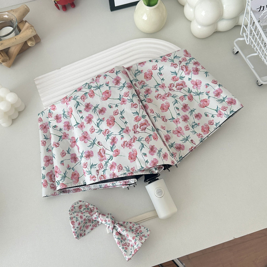 Women's folding umbrella with floral design and practical storage system Stornfield