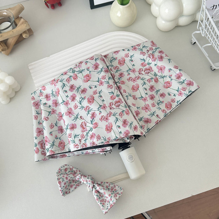 Women's folding umbrella with floral design and practical storage system Stornfield