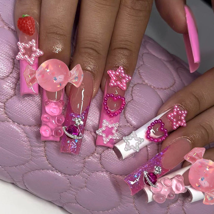 Glamorous artificial nail set with sparkling rhinestones and cross decorations Stornfield