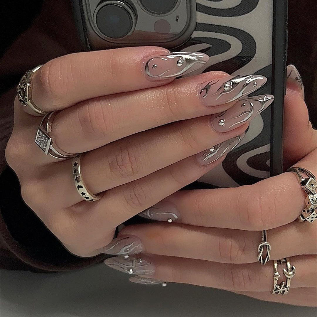 Nail set with elegant water drop design and 3D accents Stornfield