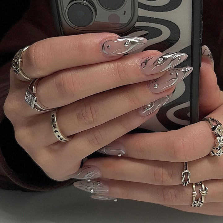 Nail set with elegant water drop design and 3D accents Stornfield