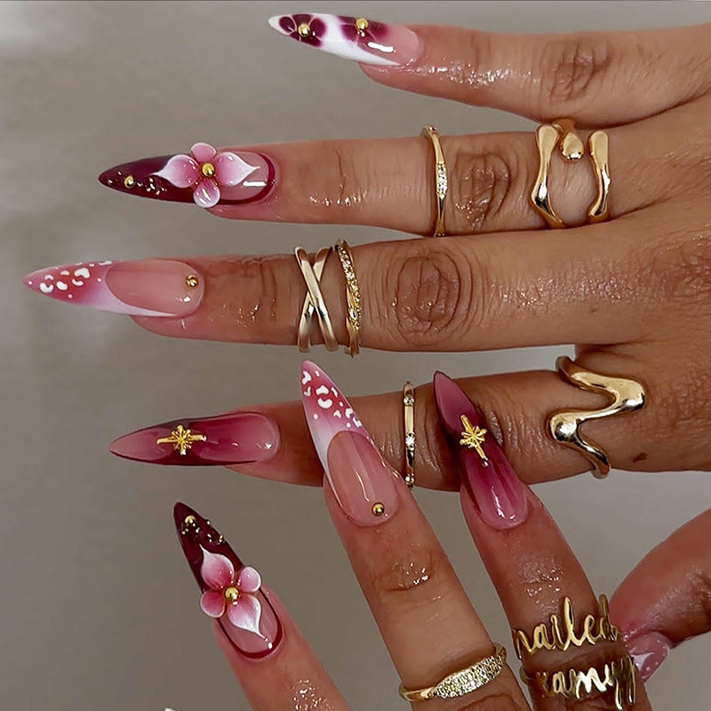 Artifical nail set with delicate floral design and glamorous accents Stornfield