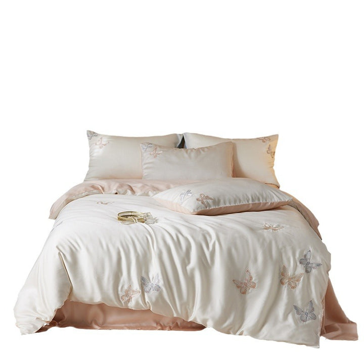 Reversible bedding set made of cotton percale with finely embroidered breakfast motifs