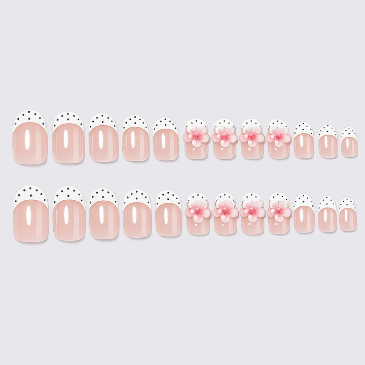 Artificial nail set with delicate floral designs and elegant accents Stornfield